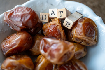 dried fresh dates on a plate macro shot