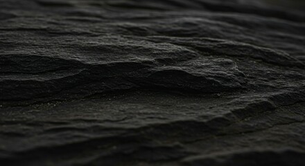 Obraz premium Black abstract background. Grunge background with copy space. The surface of the mountain close-up. Dark gray stone background. Rock texture.