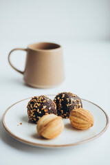 Homemade dessert for coffee, nut cake with condensed milk and chocolate ball.