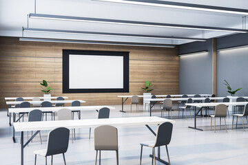 Modern auditorium with white screen and seating arrangement. 3D Rendering