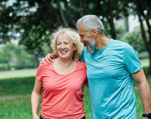 fitness woman man active sport exercise together running jogging healthy fit middle age mid mature runner jogger outdoor happy adult couple