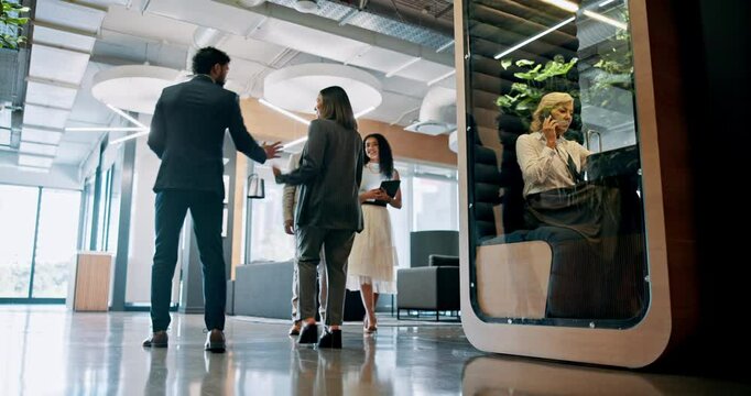 Collaboration, talking and business people walking in lobby of office with pod for friendly greeting. Conversation, discussion and goodbye with corporate employee group in workplace for conference
