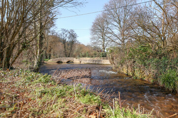 Dunster, Somerset, England. Old bridge over the river.