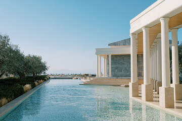 Long pool near a patio with columns. Hotel Amanzoe. Peloponnese, Greece