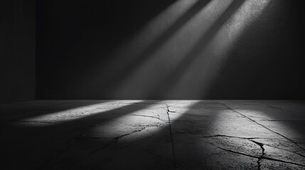 Dark Room with Light Beams Illuminating Cracked Floor: A Monochromatic Study in Shadows and Texture