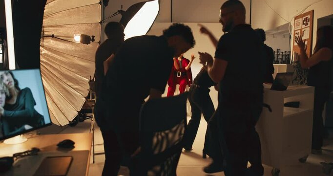 People, photographer and fashion photoshoot in studio, backstage prep, production process and shooting. Model, team and bts with catalog for photography casting, beauty magazine and creative industry