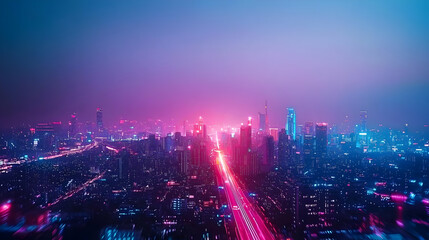 Obraz premium Aerial View Of Illuminated City With Long Road And Lights During Evening Blue And Purple Hues