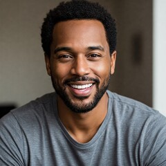 Obraz premium Handsome African American Man Smiling in Grey T-Shirt