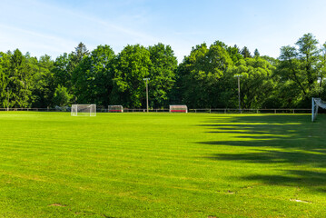 small training soccer field. football field with a green grassy covering.