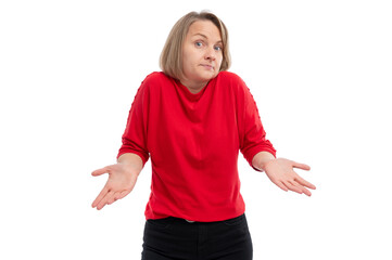 A woman in a red shirt with a puzzled expression, shrugging her shoulders against a white...
