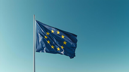 European Union Flag Waving Against Clear Blue Sky With Golden Stars Showing National Symbolism In Daylight