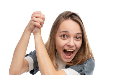 A young woman with long hair smiling and raising her arms in excitement against a white background.