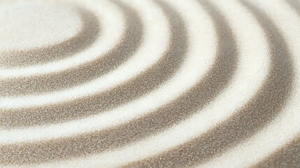 Concentric circles pattern drawn in white and beige sand creates zen garden effect, radiating from corner. Peaceful meditation and wellness background for spa designs.