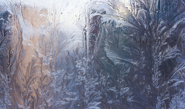 Blue Frost Background, Closeup Frozen Winter Window Pane Coated Shiny Icy Frost Patterns, Extreme North Low Temperature, Natural Ice Pattern on a Frosty Glass
