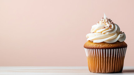 Delicious cupcake with creamy frosting and chocolate sprinkles on pastel background