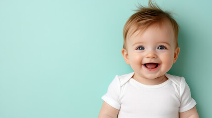 Naklejka premium Happy baby with curious gaze on pastel green background