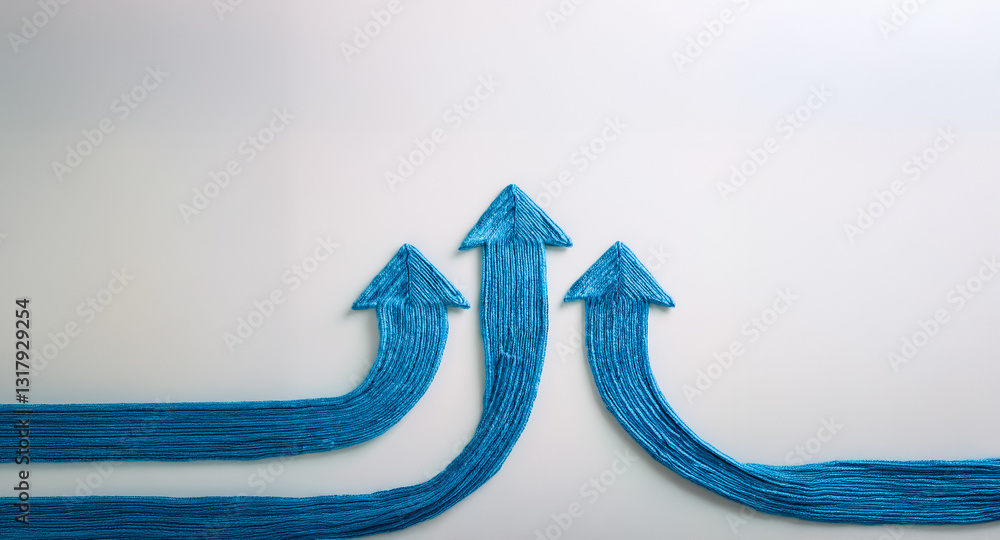 Poster three blue textured arrows pointing upward on a white surface, suggesting movement and progress. the