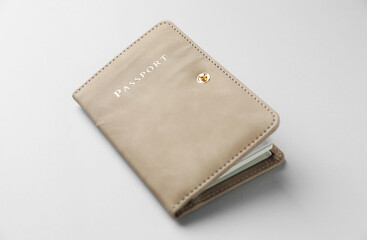 Passport in bright cover on grey background, closeup