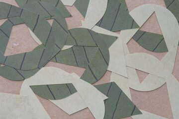 Obraz premium scattered machine-cut pill and diamond paper shapes on plain brown paper