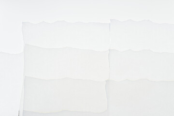 torn tissue paper edges arranged on an illuminated surface