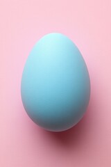 Single blue Easter egg on pastel background for minimalist high-resolution photography concept