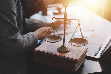Judge gavel with Justice lawyers having team meeting at law firm background. Concepts of Law and...