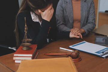Judge gavel with Justice lawyers having team meeting at law firm background. Concepts of Law and...