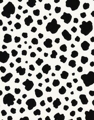 an abstract image with a pattern of irregular black spots on a white background, resembling a Dalmatian's coat.