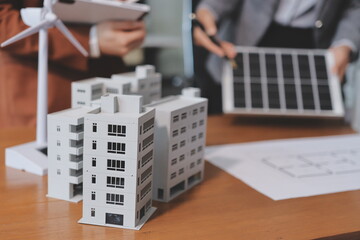 Discussion among businesspeople on the latest developments in solar cell panel technology and Solar...