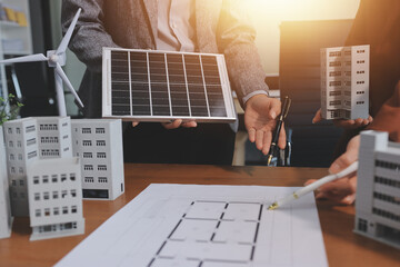 Discussion among businesspeople on the latest developments in solar cell panel technology and Solar...