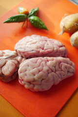 Fresh animal brains prepared for a culinary dish in a kitchen setting