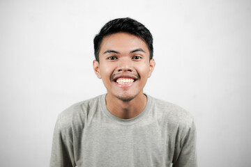Portrait of asian man showing excited expression, young man isolated on white background