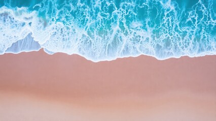 aerial view of a beach with a wave crashing on the sand,