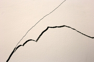 Building problem wall cracked., House structural foundation cracked.