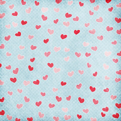 Vintage blue textured background with scattered pink and red hearts, seamless romantic pattern perfect for Valentine’s Day cards, scrapbook paper, gift wrap, fabric and love-themed designs.