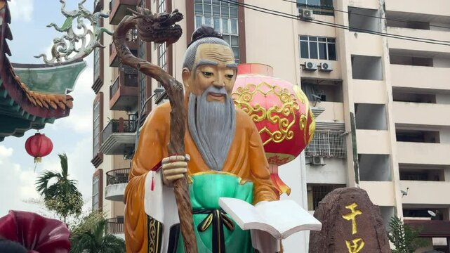 Chinese god statue in Thean Hou Temple courtyard, Kuala Lumpur, Malaysia.