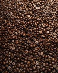 Fototapeta premium A steaming cup of coffee surrounded by scattered coffee beans.