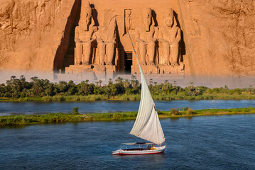 Beautiful Nile scenery with sailboat in the Nile on the way to The Front of the Abu Simbel Temple -...
