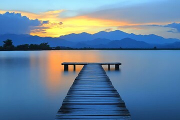 Fototapeta premium Serene Sunset over Calm Lake with Wooden Pier and Mountains
