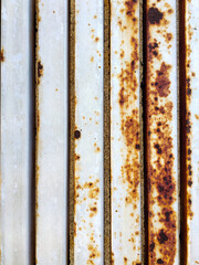 Detail of rusty metal surface with flaking paint and corrosion, abstract background. 