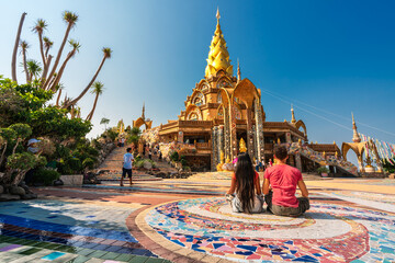 Couple travel people enjoy beautiful view Thailand temple Wat Phra Thart Pha Sorn Kaew. Asian culture, religion and travel destination in Asia