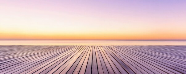 Wooden deck facing calm sea and beautiful colorful horizon at sunset