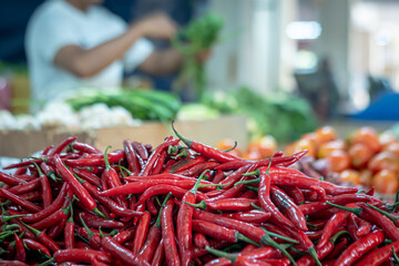 Activities in the vegetable and spice trader stand (red chilli, onion, garlic, tomat, cayenne...