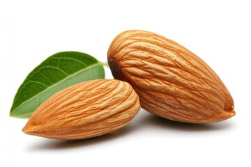 Two almonds with leaves isolated on white.
