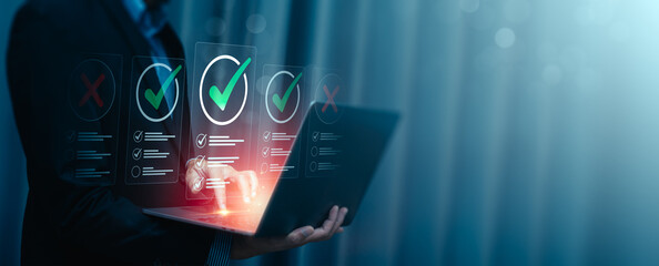 Business Professional Evaluating Checklists on Laptop with Futuristic Virtual Interface, Highlighting Quality Assurance, Decision-Making, Task Management, Project Planning, Successful Goal Completion