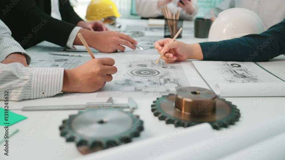 Poster a group of engineers engages in a collaborative design meeting, analyzing technical drawings and pro