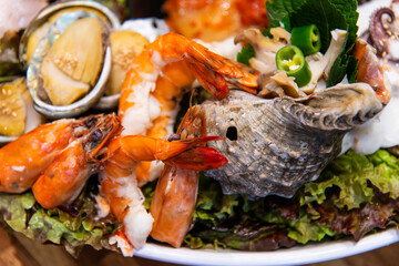 steamed conch and prawn with other food and vegetables