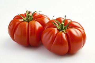 Two heirloom tomatoes studio shot on white background culinary freshness vibrant colors raw ingredient healthy eating