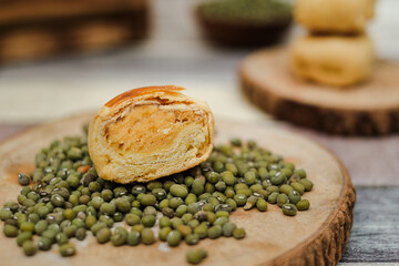 Close Up Sliced Bakpia, The Traditional Food from Yogyakarta, Made from Mixture of Green Beans and Sugar. Served on the green beans.