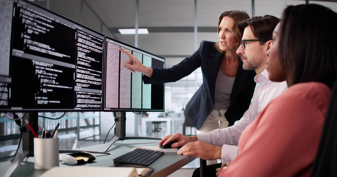 Busy professionals work together on diverse software coding projects